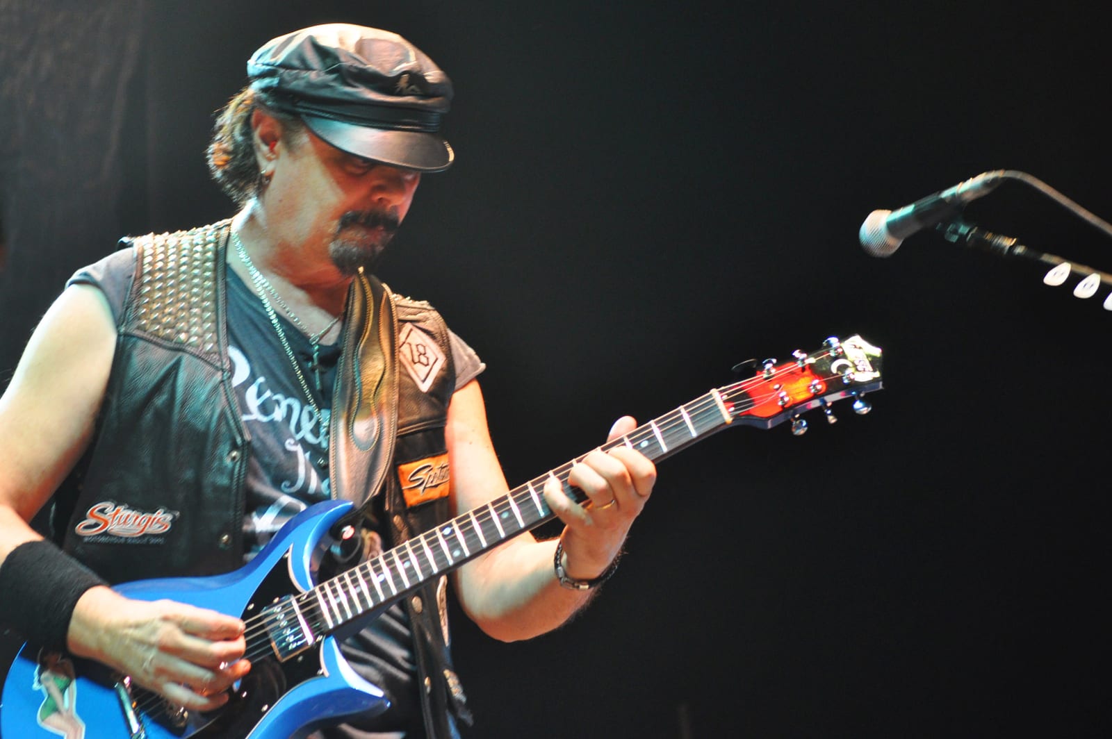 Steve Hunter playing guitar onstage with Alice Cooper in Rennes in 2011