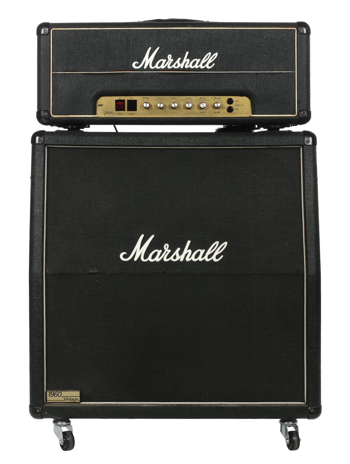 A Marshall JMP amplifier head sitting on a worn Marshall 1960 four-by-twelve speaker cabinet