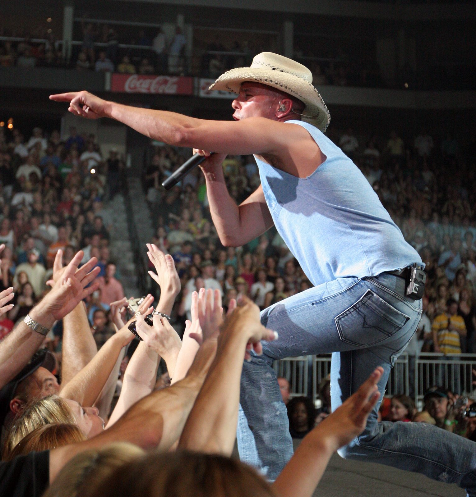 Kenny Chesney performing on a large outdoor stage